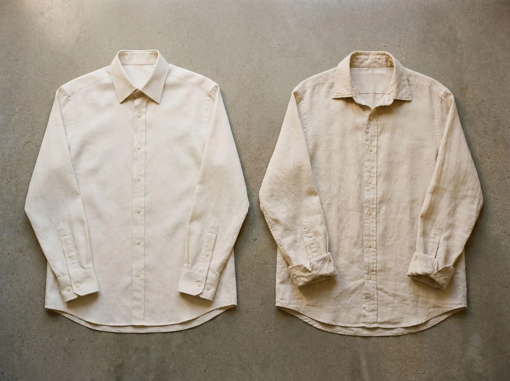 Two parchment linen shirts laid flat side by side — year one (left) and year three (right). Same garment; the right shirt shows softened cuff folds and slightly deeper colour saturation from years of wear and wash.