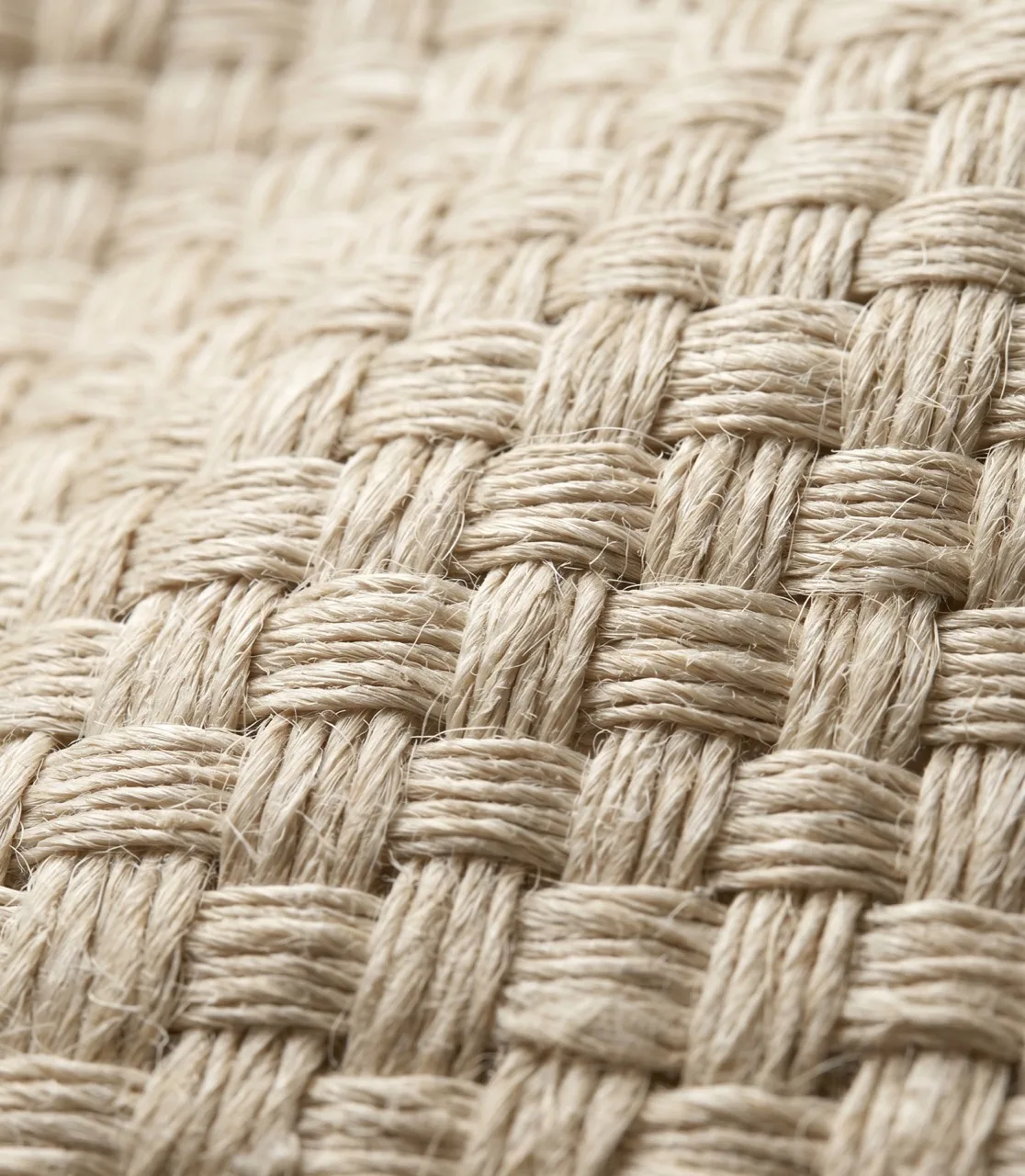True 1:1 macro of cream long-staple linen weave — individual fibre slubs visible